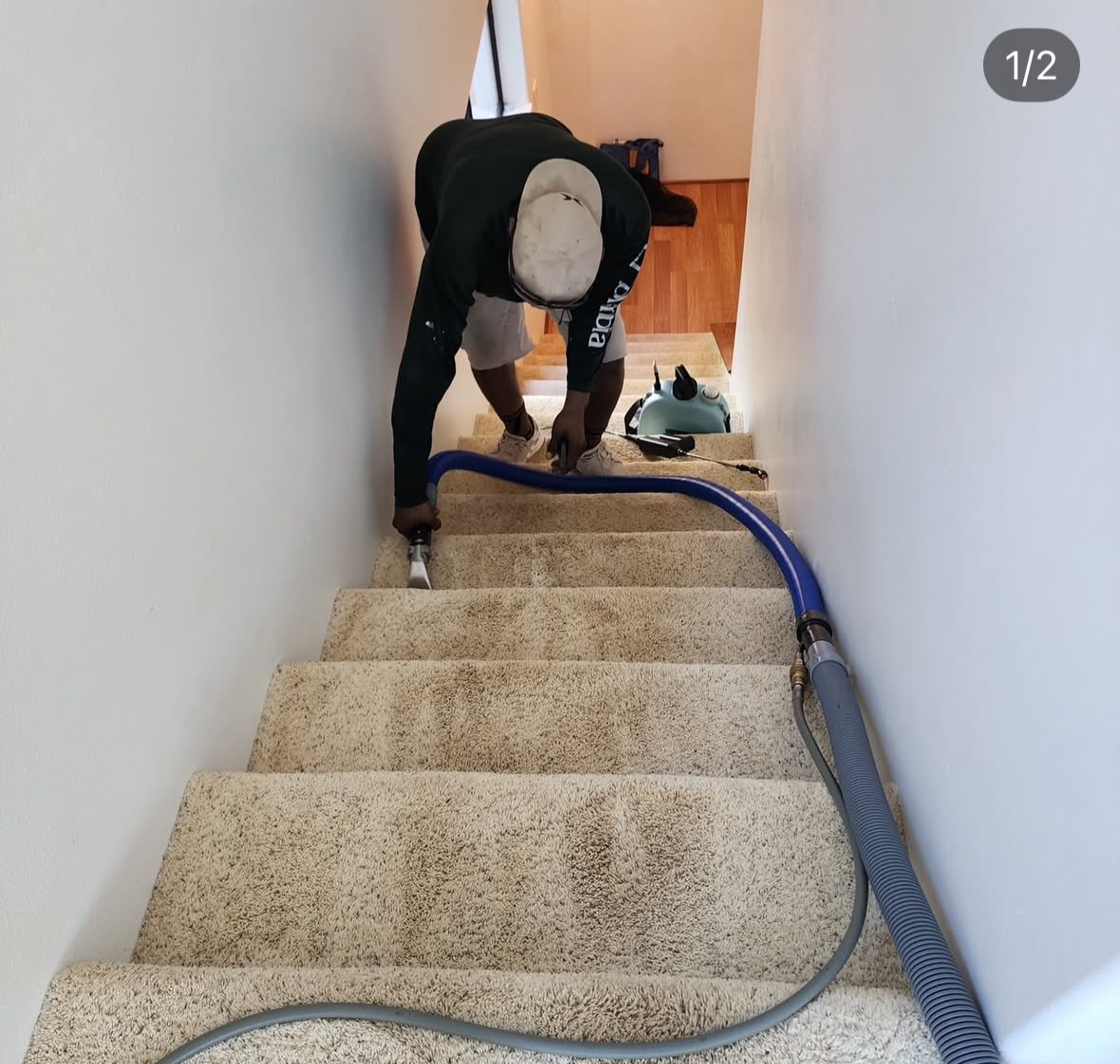 Aloha Tile and Carpet technician cleaning a carpet.
